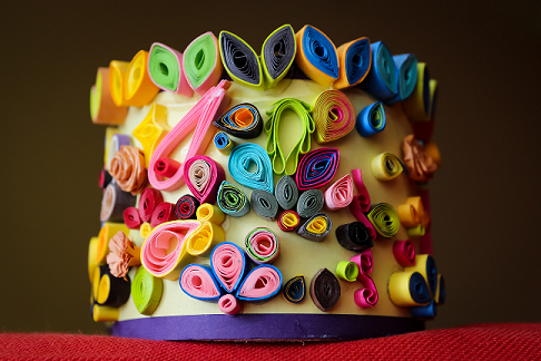 quilled paper attached to a cylinder