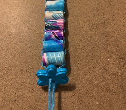 button strung on bracelet from the back