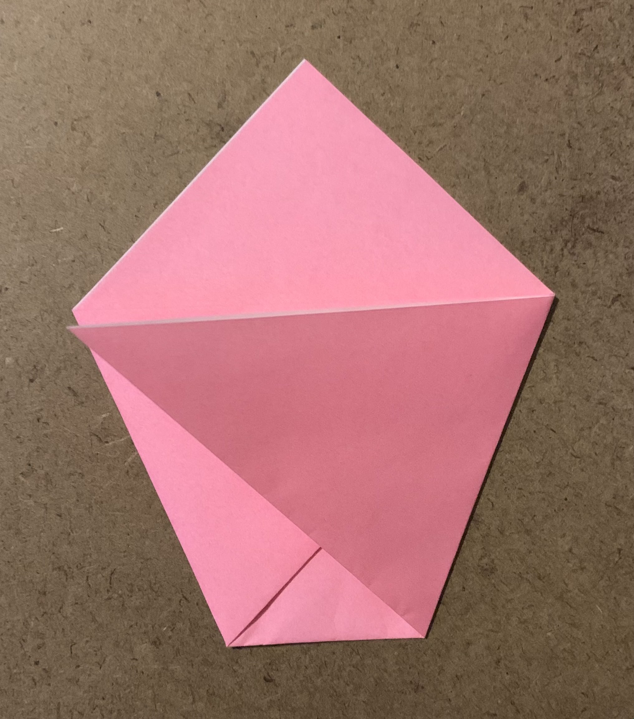 bottom right corner of triangle folded to middle left